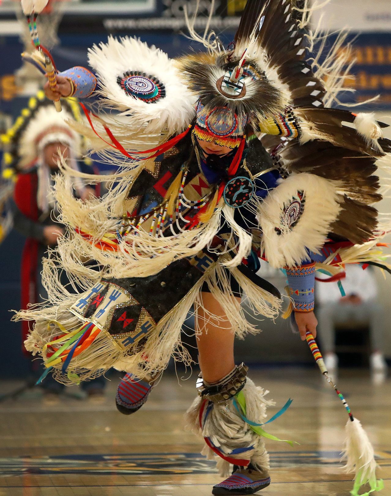 Native dancers perform during halftime